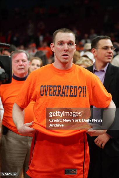 Syracuse Orange guard Gerry McNamara slips on an "Overrated?!!" T-shirt after the Orange defeated the Pittsburgh Panthers, 65-61, in the Big East...