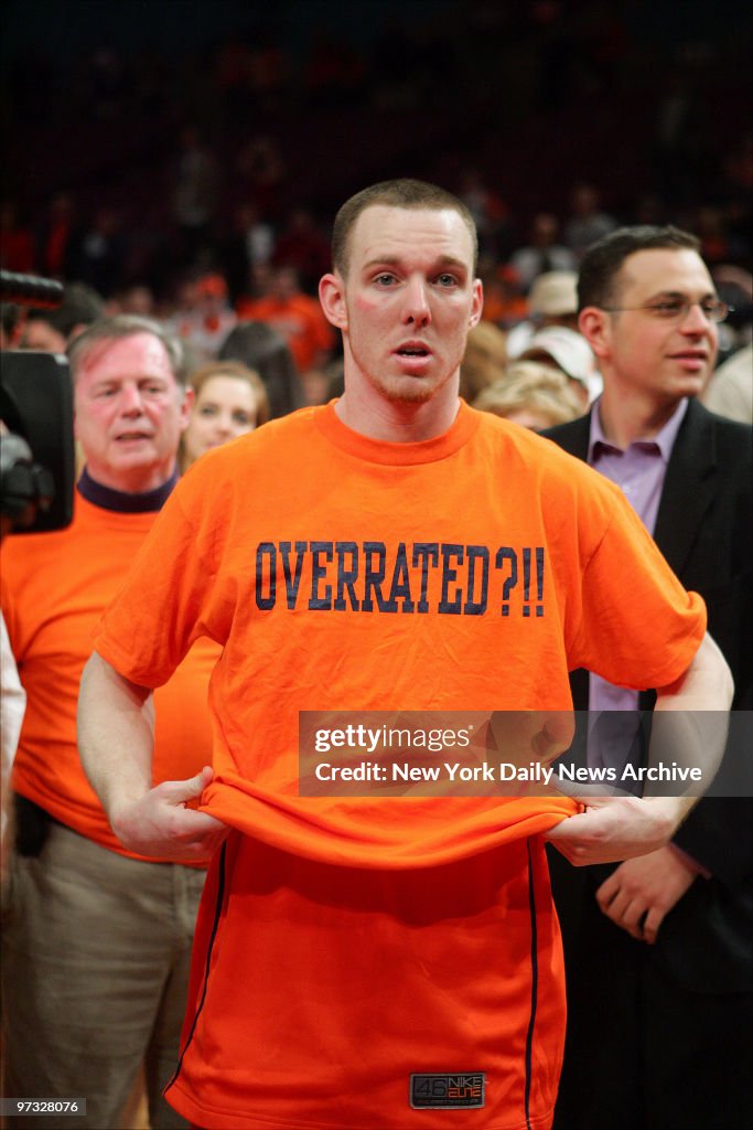 Syracuse Orange guard Gerry McNamara slips on an "Overrated?