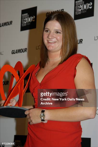 Kelly Clark holds the award she was given for bringing women's extreme sports into the mainstream at Glamour Magazine's annual Women of the Year...