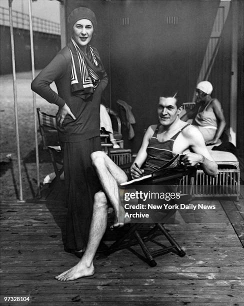 Notables at Atlantic Beach Club. Photo Shows Peter Arno, autographing his latest opus for mary Brown Warburton, social registrite, at the Smart...