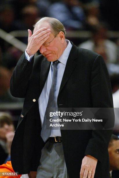 Syracuse Orangemen's head coach Jim Boeheim holds his head during the second half of an NCAA Big East quarterfinal game against the Boston College...