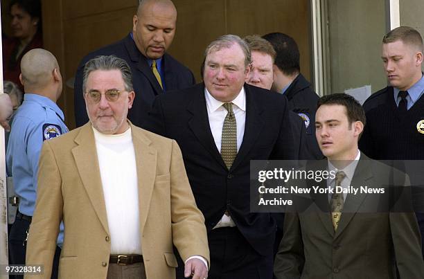 Michael Skakel leaves Stamford, Conn., court with his defense team after he was arraigned for murder in the 1975 death of his teenage neighbor Martha...