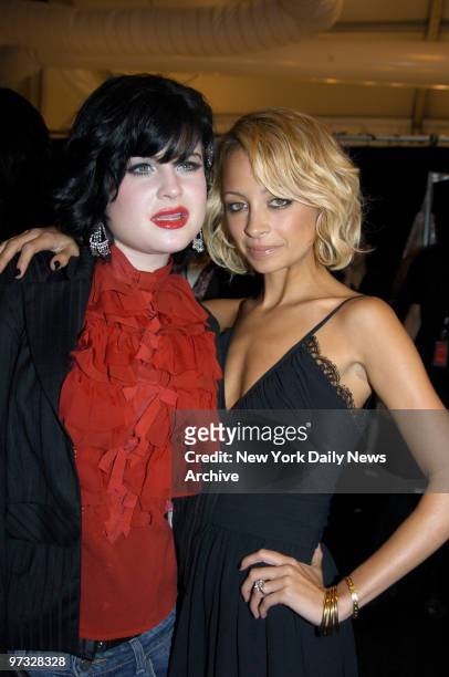 Kelly Osbourne and Nicole Richie, who both modeled in the Fashion for Relief runway show, embrace backstage at the event, which was held in the tents...
