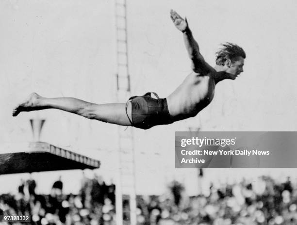 Swimmer and actor Johnny Weissmuller takes off from diving board during Daily News Water Derby at Zachs Bay at Jones Beach, L.I.