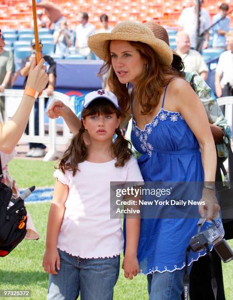 Kelly Preston and daughter Ella are on the field at Shea Stadium before the start of a game between the New York Mets and Pittsburgh Pirates. Ella...