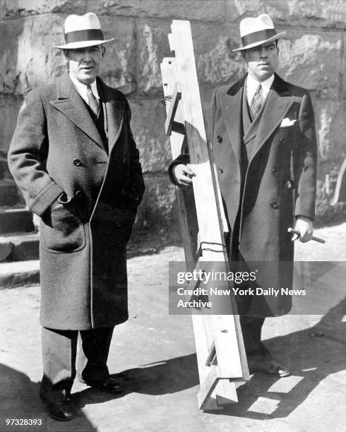 Det. Robert Coar and Inspector Harry Walsh with the ladder found at the nursery window after the Lindbergh baby kidnaping, one of the few tangible...