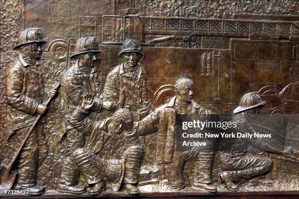 Detail of the first permanent Ground Zero memorial to the FDNY's lost heroes of 9/11, a 56-foot-long bronze bas-relief sculpture on the side of the...