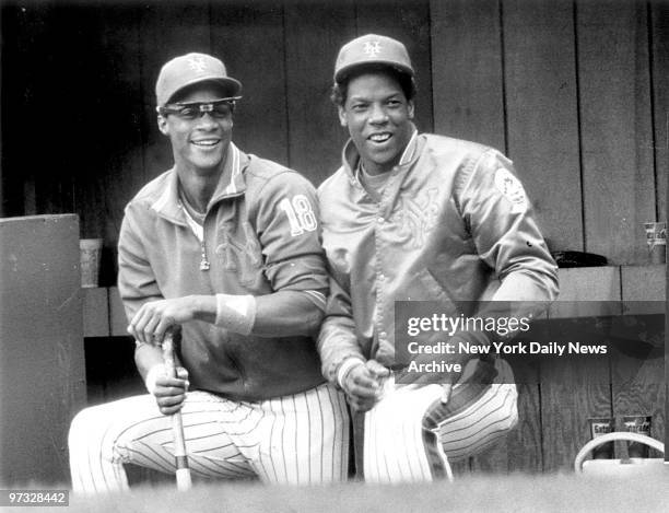 New York Mets' Darryl Strawberry and Dwight Gooden watch from the dugout steps as the season comes to an end.