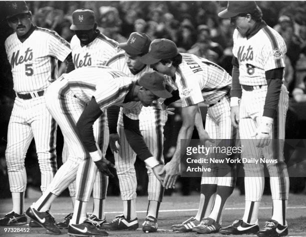 New York Mets' Darryl Strawberry gets a low-five from teammate Keith Hernandez as Gary Carter looks on during pre-game introductions at Shea Stadium...