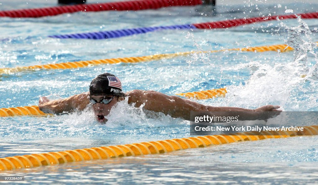 Swimmer Michael Phelps of the U.S. competes in the 100-meter