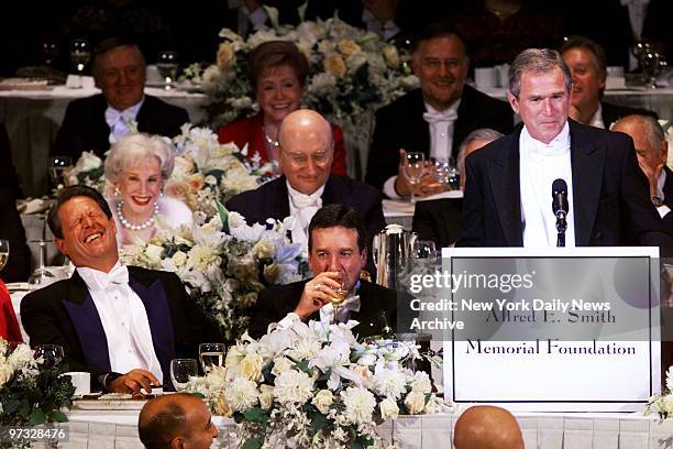 Vice President and Democratic presidential candidate Al Gore and Alfred E. Smith IV laugh as Republican presidential candidate George W. Bush tells a...