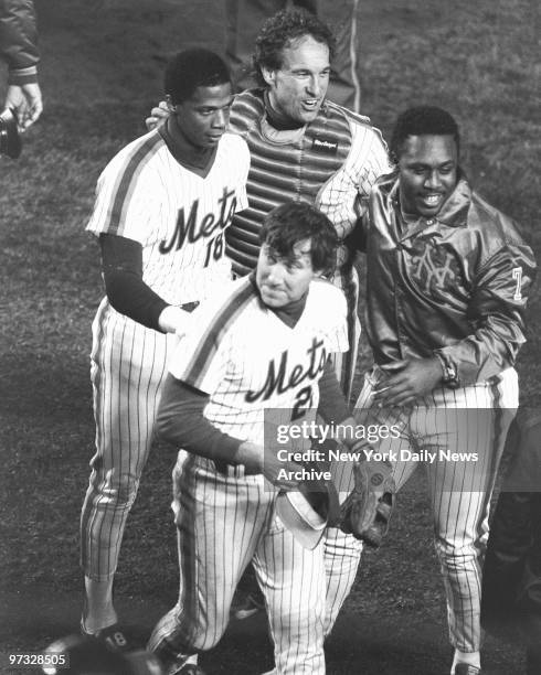 New York Mets' Darryl Strawberry, Gary Carter, Kevin Mitchell and Series MVP Ray Knight celebrate Mets 8-5 win over the Boston Red Sox in Game Seven...