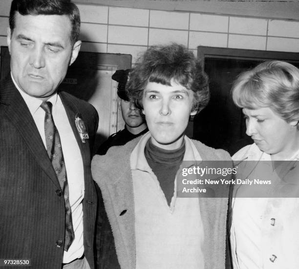 Detective Frederick Stepat and policewoman McCarthy escort Valeria Solanas into 13th pct, for the shooting of Pop Art movie man Andy Warhol at his 33...