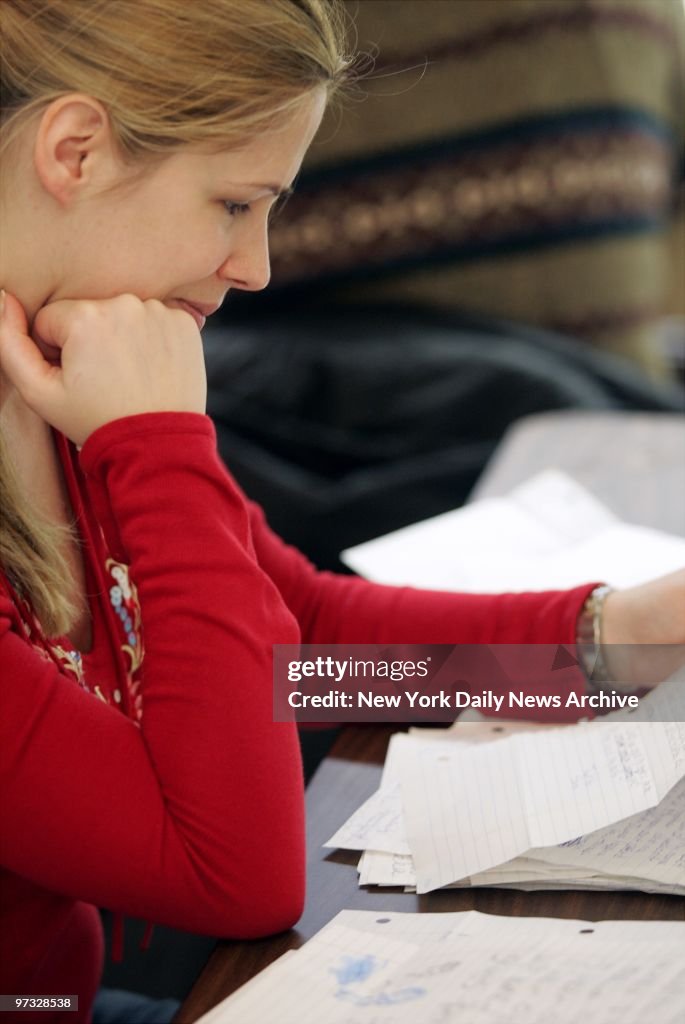 Michaela Ambrosius, an immigrant from Germany, reads some of