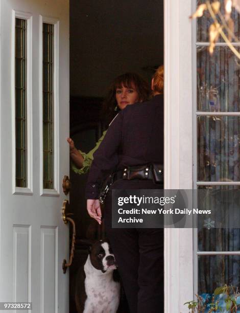 Michaella Oefelein, ex-wife of astronaut William Oefelein, opens the door to her Houston home for a police officer. Lisa Marie Nowak, a 43-year-old...