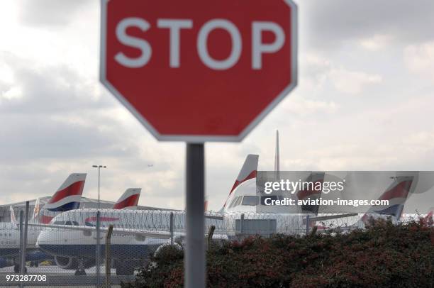 Stop sign with British Airways Airbus A321-200, A320s and A319s parked during the strike by British Airways cabin-attendants of the Unite trade-union...