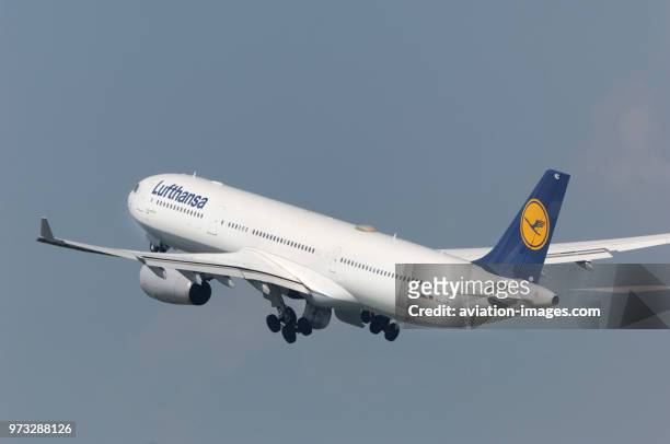 Lufthansa Airbus A330-300 climbiong out after take-off with undercarriage retracting.