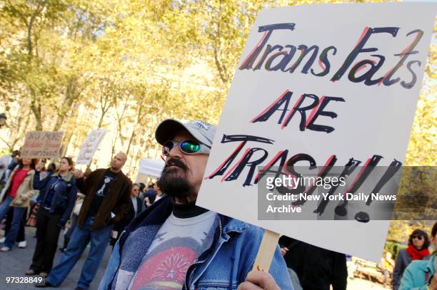Kenneth Christy joins other protesters at an anti-trans fat rally in Thomas Paine Park as the Board of Health holds its first public hearing on a...