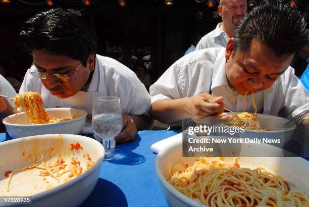 Victor Quontuna of Sorrento Ristorante, and Alberto Pevez from Caffe Napoli, scarf down spaghetti during the 4th annual Tuttorosso Pasta Eating...