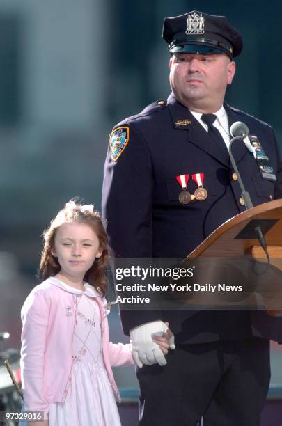 Patricia Mary Smith holds hands with her father, Office James Smith, during a memorial service to commemorate the fifth anniversary of the Sept. 11...