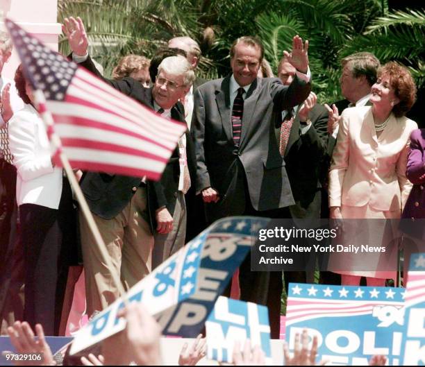 Vice presidential candidate Jack Kemp , presidential candidate Bob Dole and his wife, Elizabeth, wave to supporters Sunday on their arrival at...