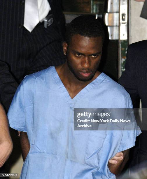 Kenny Alexis is taken from the Midtown North precinct stationhouse after he was taken into custody outside a McDonald's in Times Square for stabbing...