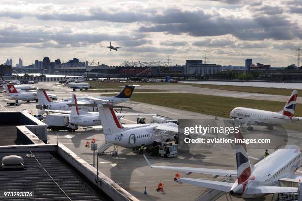 CityJet BAE Avro RJ-85s, Fokker F-50, Swiss BAE 146 Avro RJ-100 parked, Lufthansa Cityline BAE Avro RJ-100 and British Airways BA CityFlyer Embraer...