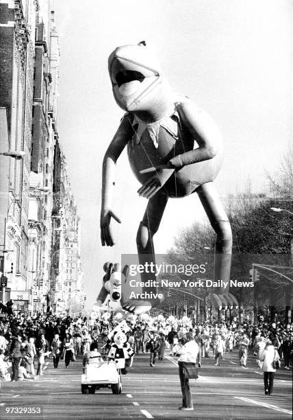 Kermit the Frog precedes Underdog during the Macy's Thanksgiving Day Parade along Central Park West.