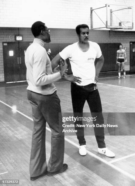 Kermit Washington huddles with Celtic coach Satch Sanders at Ignatius Loyola School. Kermit is coming off his supension, a result of the Rudy...