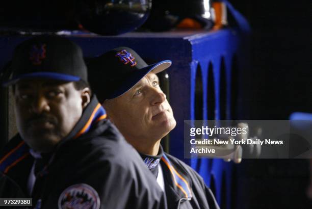 New York Mets' manager Art Howe looks up to ponder his team's situation in a game against the Houston Astros at Shea Stadium. Next to him in the...