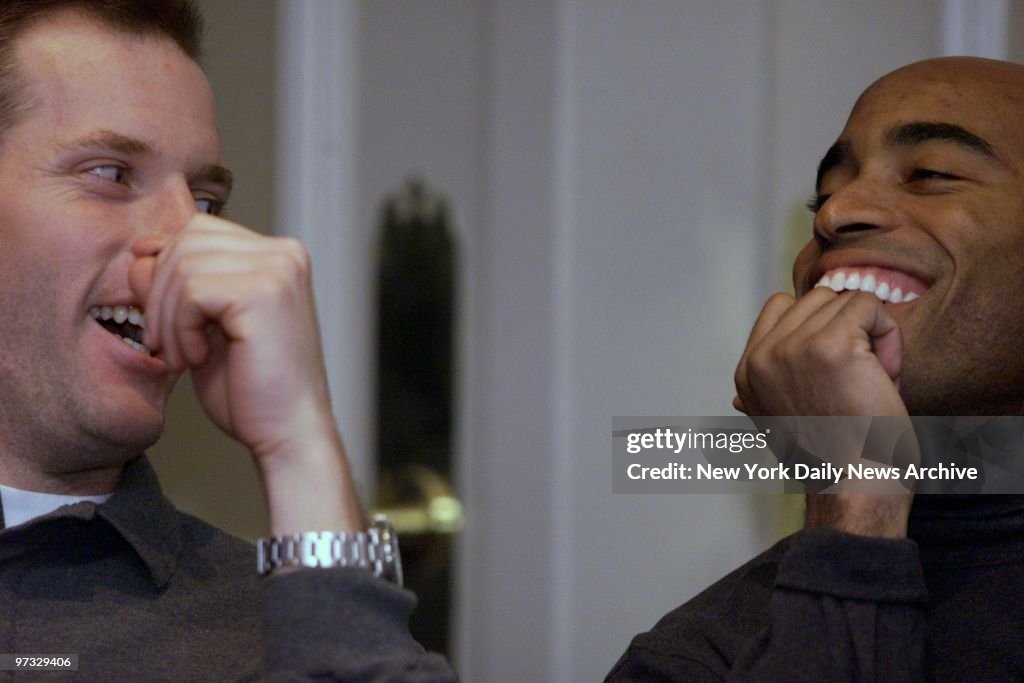 Kerry Collins and Tiki Barber of the New York Giants goof ar