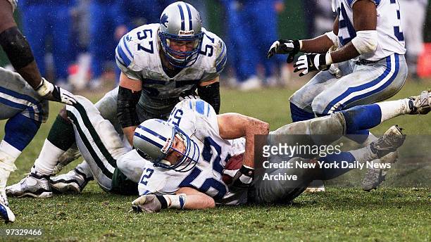 Detroit Lions' Scott Kowalkowski grabs the ball after a fumble by New York Jets' Richie Anderson late in the fourth quarter at Giants Stadium. The...