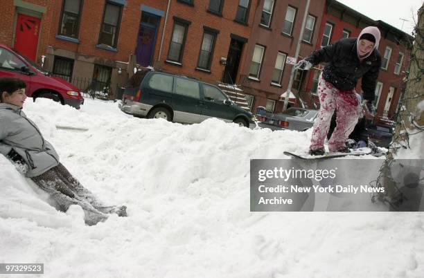 Victoria Attianese has her own snowboarding hill outside her house in Carroll Gardens, Brooklyn. Her friend, Dina Ventre is inclined to watch.
