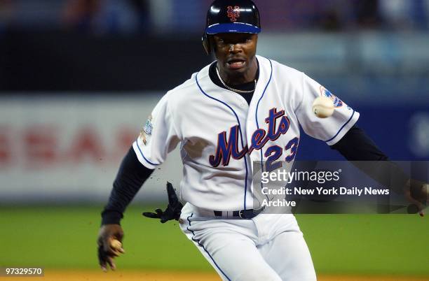 New York Mets' Esix Snead outruns a throw to get back to first base safely during Game 2 of a double header against the Atlanta Braves at Shea...
