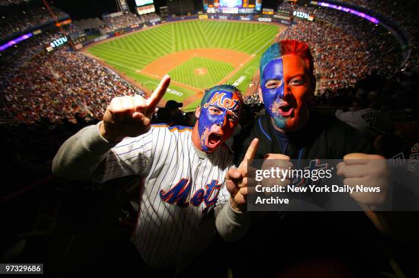 New York Mets' fans Dan Pena and pal Chris Maietta, both of Westbury, L.I., cheer on their team before the start of Game 1 of the National League...