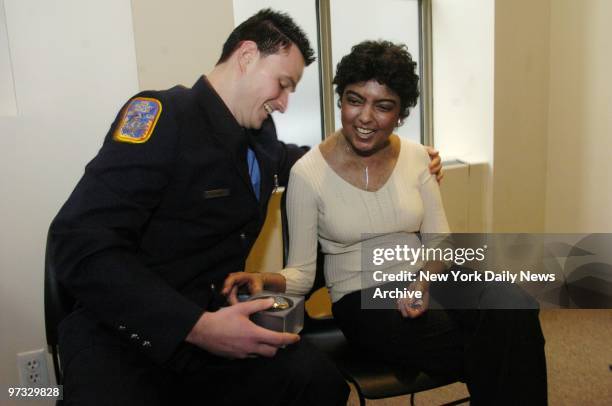 Devendar Mata presents a silver watch engraved with the words "None Can Compare" to her benefactor, Harlem Firefighter Peter McMahon, who donated...