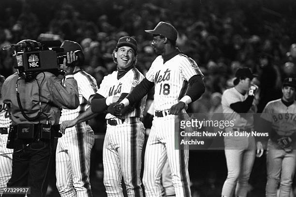 New York Mets' Gary Carter and Darryl Strawberry share a laugh during pre-game introductions at Shea Stadium prior to Game One of the 1986 World...