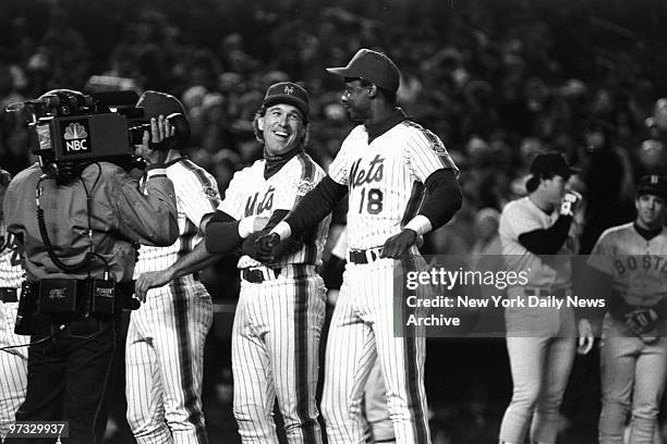 New York Mets' Gary Carter and Darryl Strawberry share a laugh during pre-game introductions at Shea Stadium prior to Game One of the 1986 World...