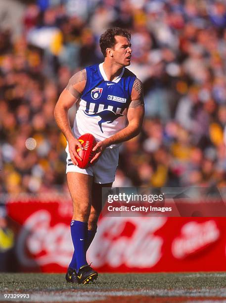 Wayne Carey of the Kangaroos looks to kick during the round 12 AFL match between North Melbourne Kangaroos and Richmond Tigers at the MCG, 1998 in...