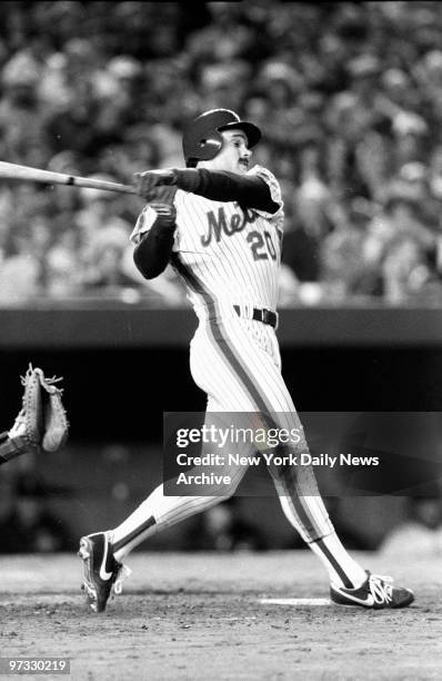 New York Mets' Howard Johsnson takes a huge swing at ball during Game Two of the 1986 World Series at Shea Stadium. Boston Red Sox defeated Mets,...