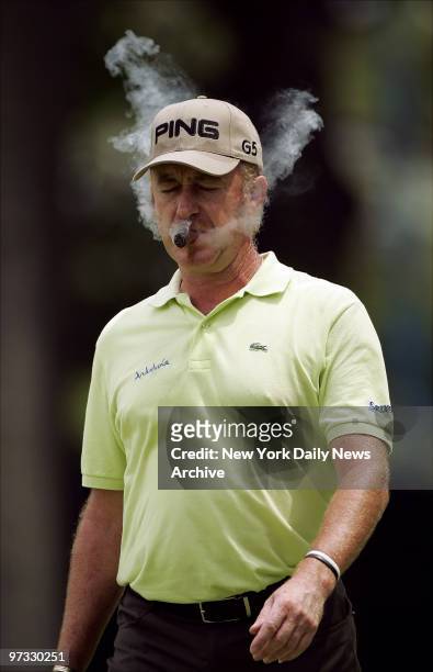 Miguel Angel Jimenez smokes a cigar on the 10th hole during a U.S. Open practice round at Winged Foot Golf Club in Mamaroneck, N.Y.