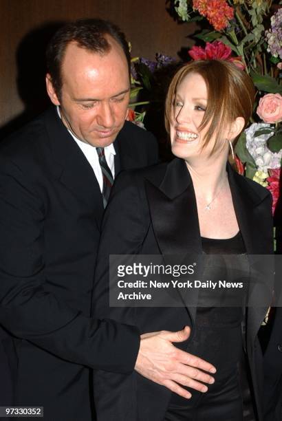 Kevin Spacey checks out pregnancy of Julianne Moore at the New York premiere of the movie "The Shipping News" at the Ziegfeld Theatre. They star in...