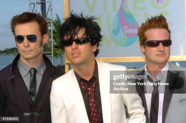 Mike Dirnt, Billie Joe Armstrong and Tre Cool of Green Day arrive at the American Airlines Arena in Miami for the MTV Video Music Awards.