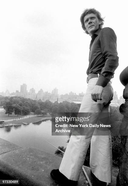Diminutive Philippe Petit, who has a large reserve of nerve, looks back momentarily from perch on the Belvedere Castle Tower in Central Park, where...