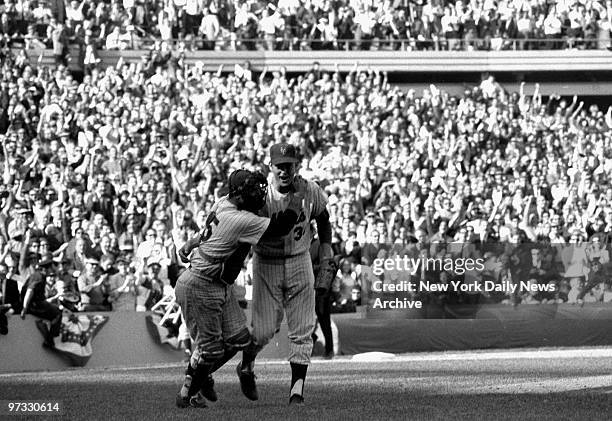 New York Mets' Jerry Grote hugs reliever - and winner - Nolan Ryan after final out of the third game against the Atlanta Braves at Shea made the Mets...