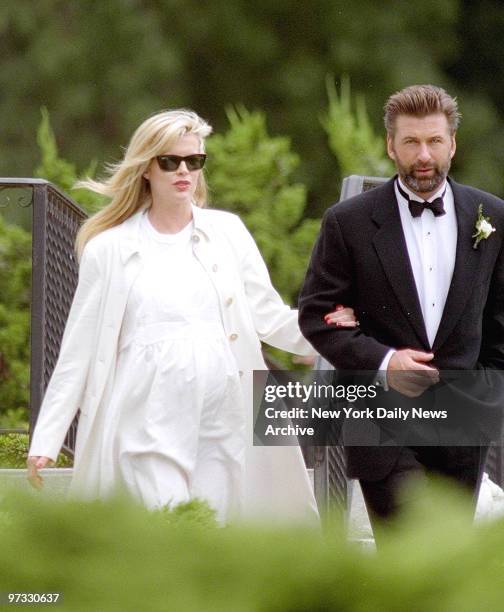 Kim Basinger and Alec Baldwin enter church where Chynna Phillips weds Billy Baldwin on Long Island. About 250 people attend the one hour ceremony at...