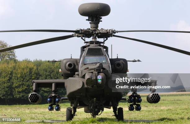 A British Army Air Corps Boeing WAH-64D Apache AH-1 with mast-mounted Longbow radar, 30 millimetre chain-gun and AGM-114 Hellfire anti-tank missiles...