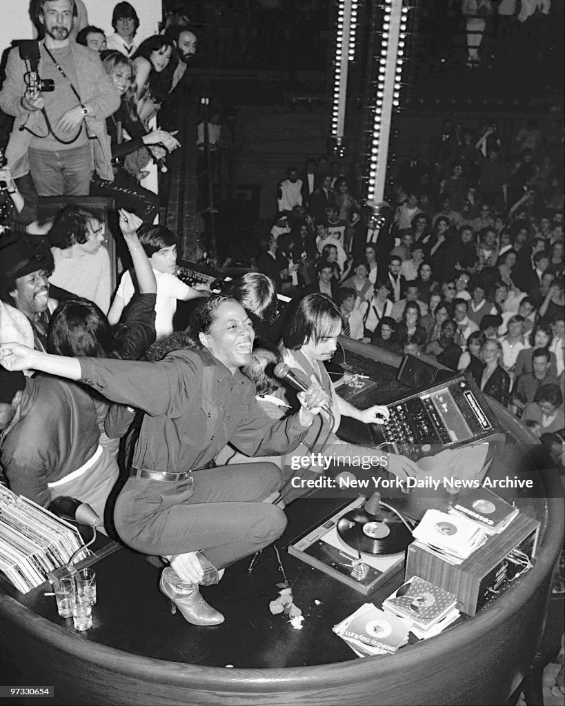 Diana Ross belts out a song from atop the disco booth at Stu