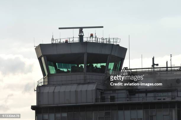 Control-tower at Manchester Airport with radar turning on top.