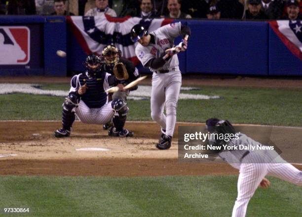 Mike Piazza breaks bat and exchanges words with Roger Clemens after Clemens throws broken piece back. Game 2, World Series at Yankee Stadium